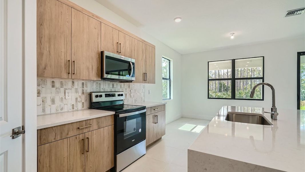 Representative furnished interior of a home built from the Avon by D.R. Horton in Preserves at Park Trace, Stuart (Image 6).