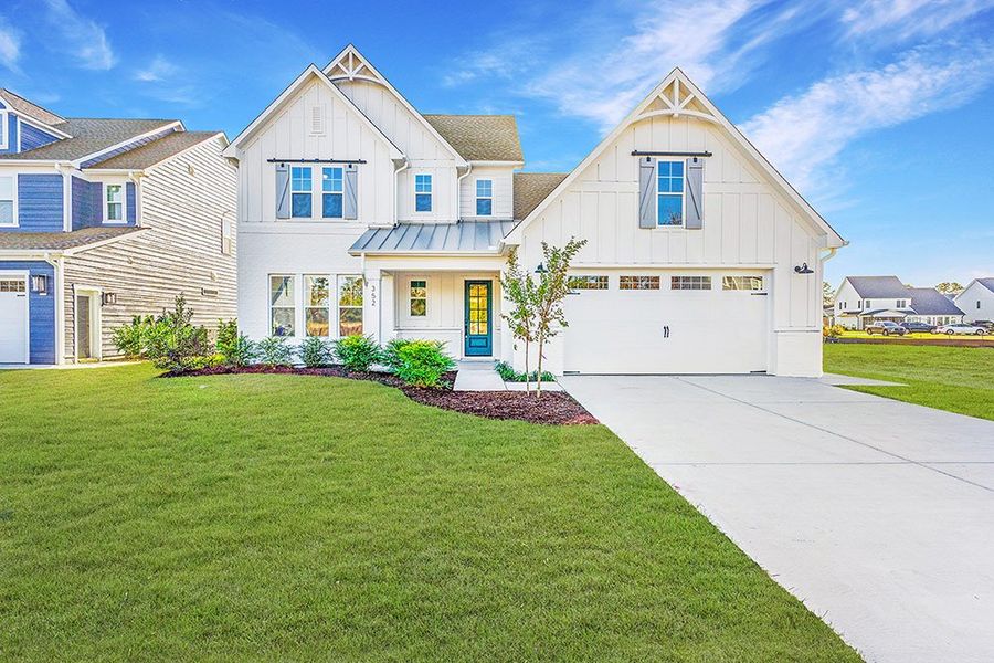 Representative exterior photo of a completed home built from the The Chandler by RobuckHomes in Windwater, Hampstead, NC (Image 22).