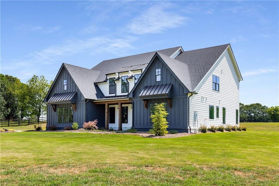 Front exterior of a new home in , Alpharetta, GA, highlighting curb appeal (Image 25). Front exterior of a new home in , Alpharetta, GA, highlighting curb appeal (Image 25).