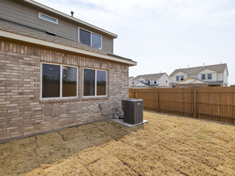 Exterior details and patio area of a home in Saddle Creek Twinhomes, Georgetown (Image 30).