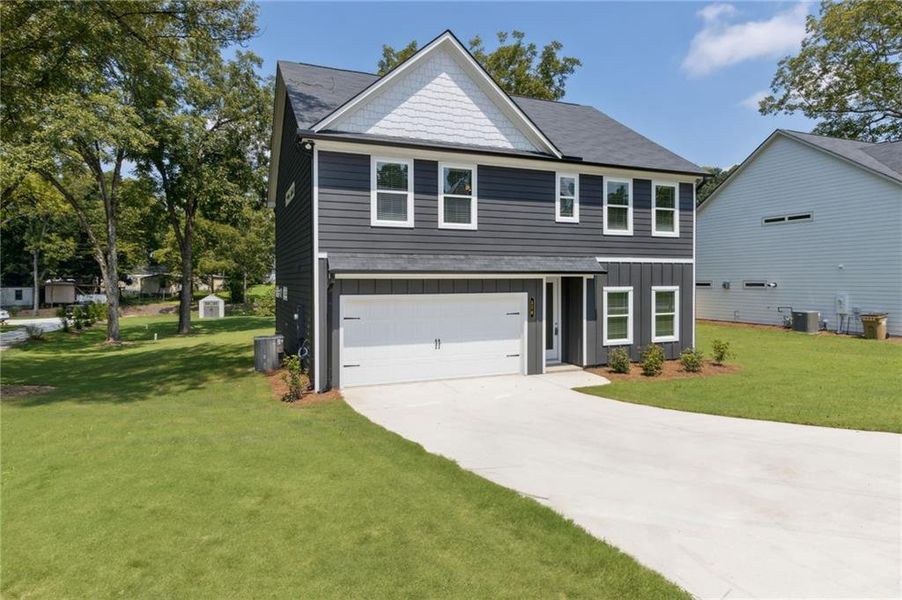 Front exterior of a new home in , Hoschton, GA, highlighting curb appeal (Image 25). Front exterior of a new home in , Hoschton, GA, highlighting curb appeal (Image 25).