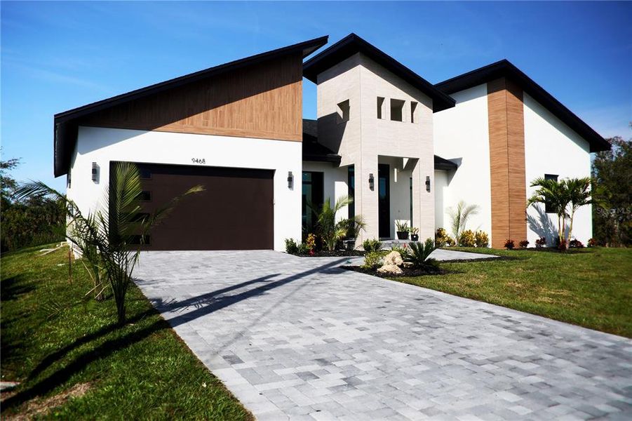Front exterior of a new home in , Port Charlotte, FL, highlighting curb appeal (Image 29). Front exterior of a new home in , Port Charlotte, FL, highlighting curb appeal (Image 29).