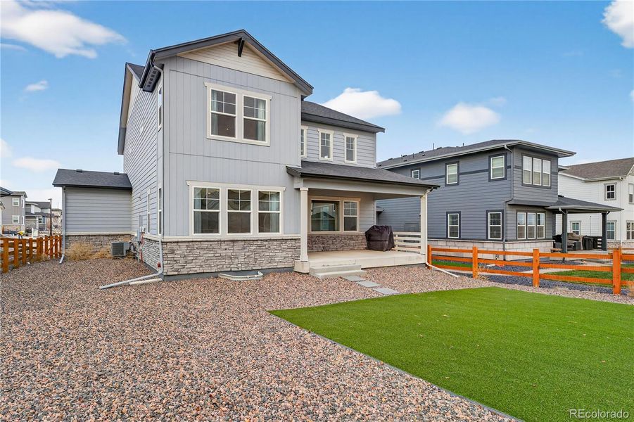 Exterior details and patio area of a home in Prelude at The Aurora Highlands, Aurora (Image 27).