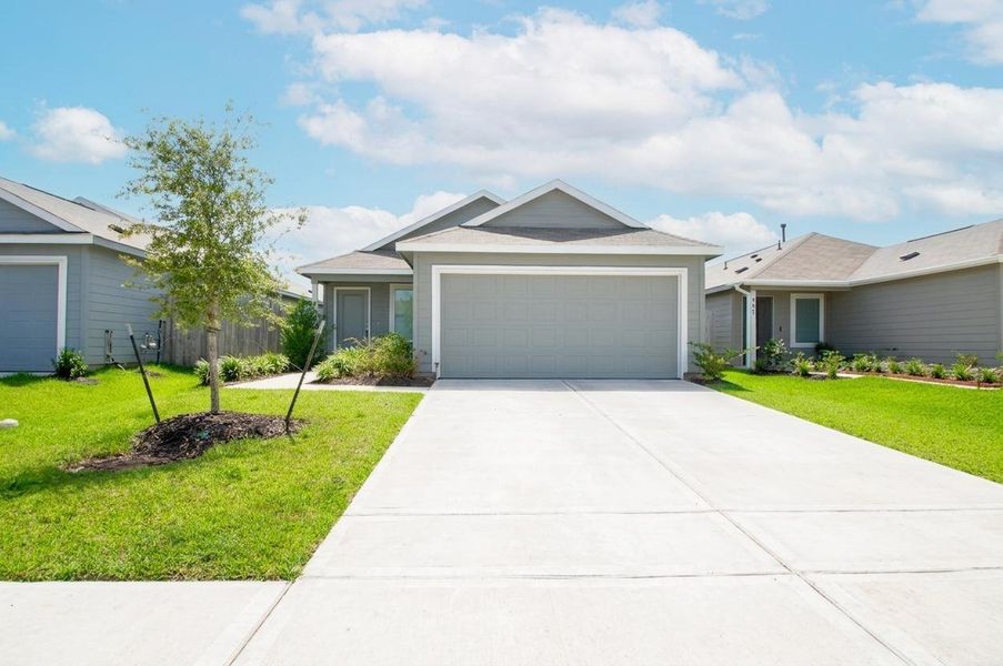 Front exterior of a new home in Wharton Lakes, Wharton, TX, highlighting curb appeal (Image 29).