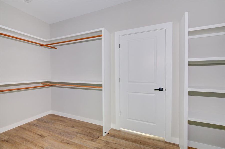 Primary closet leads to laundry room