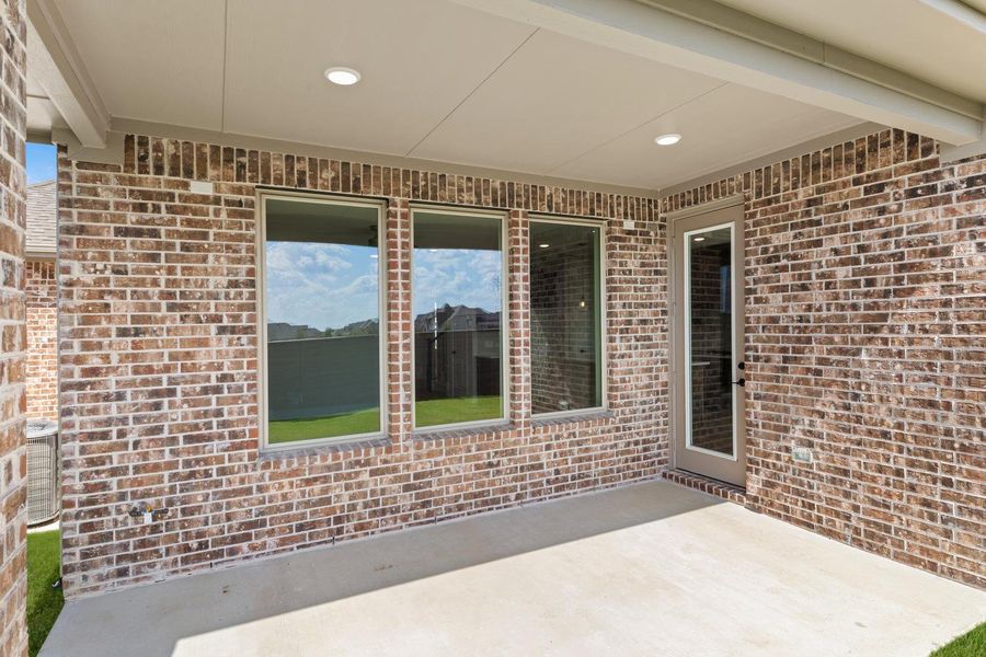 Exterior details and patio area of a home in Garden Collection at Union Park, Little Elm (Image 3).