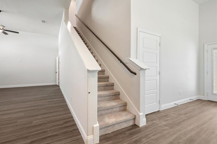 Door to Right of Stairs leads to Oversized Garage