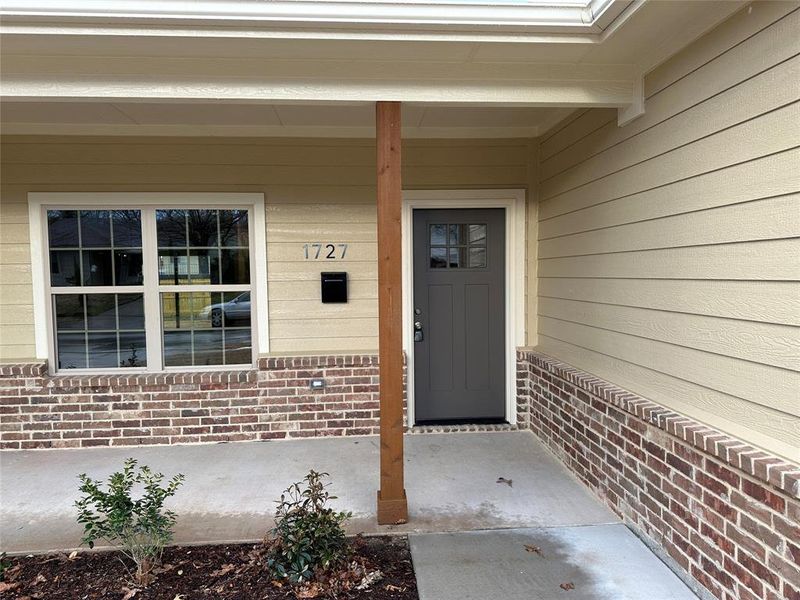 Covered porch welcomes you into this fabulous home.