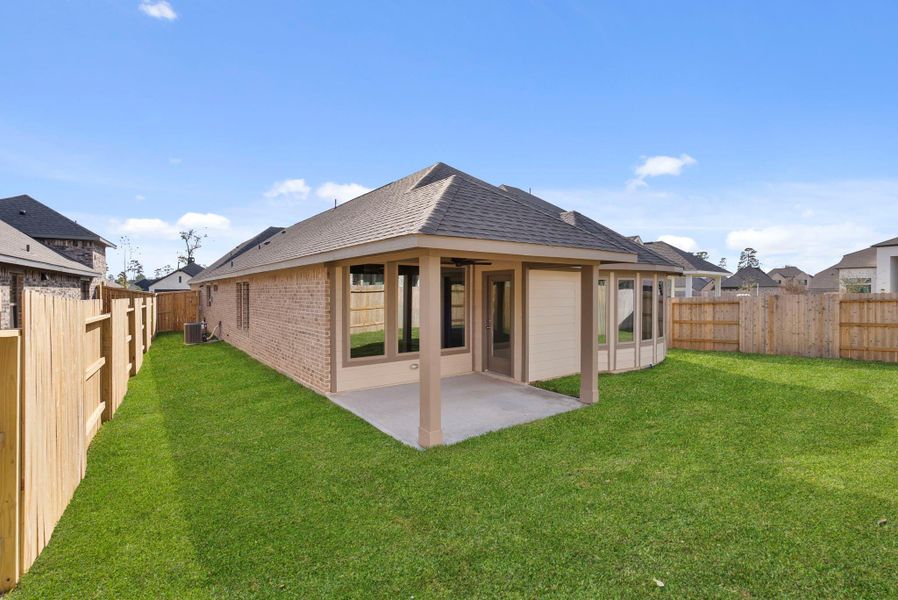 Exterior details and patio area of a home in Grand Central Park, Conroe (Image 22).