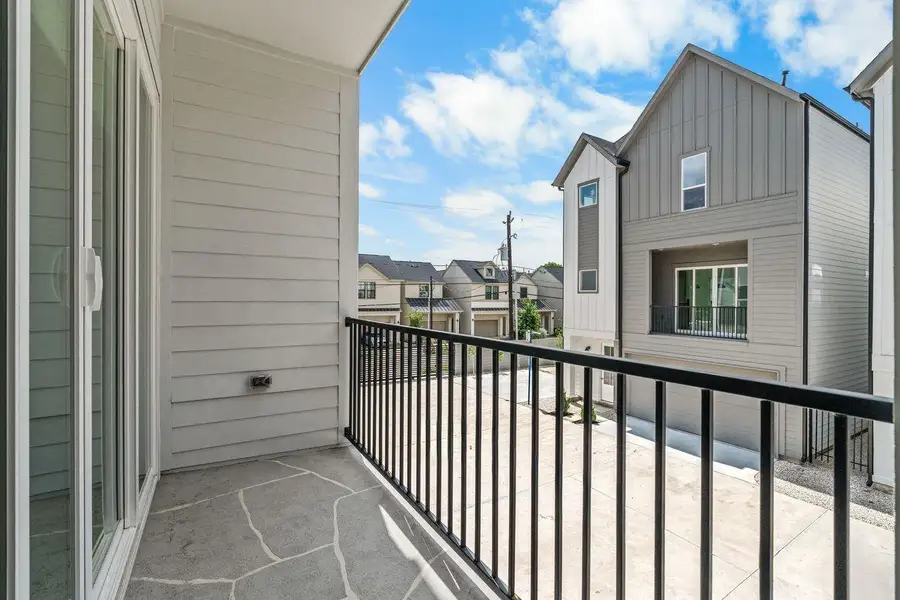 Private outdoor spaces bring another dimension to daily living. Here, a covered balcony provides a comfortable setting to enjoy fresh air, open skies, and a moment of quiet throughout the day.