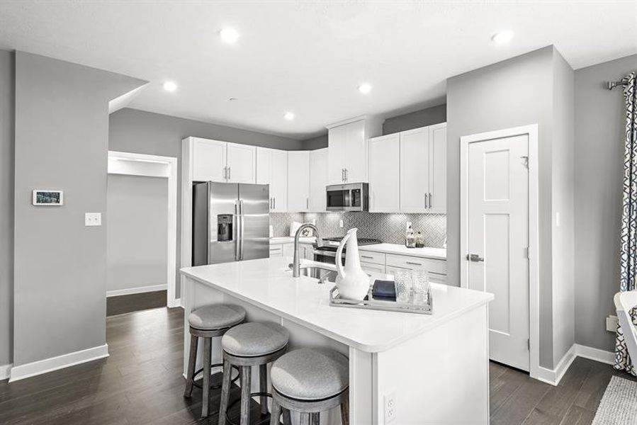 Representative furnished interior of a home built from the Rosecliff by Ryan Homes in Windsong Townhomes, Gallatin (Image 1).