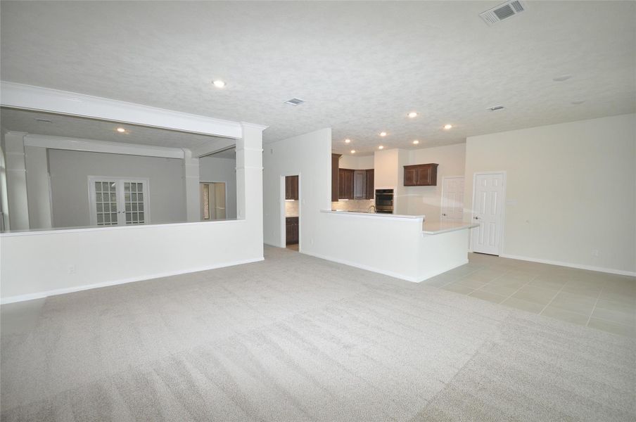 Large Family Room opens in the Formal Dining room. Very open spaces with long views.