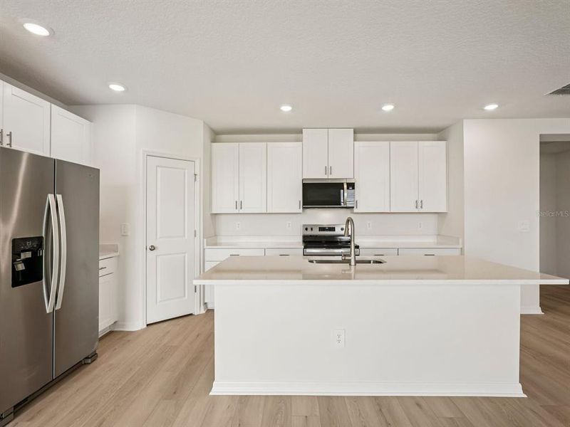 Furnished interior view inside a new home in Oakfield Trails - Classic Series, Parrish (Image 3). Furnished interior view inside a new home in Oakfield Trails - Classic Series, Parrish (Image 3).