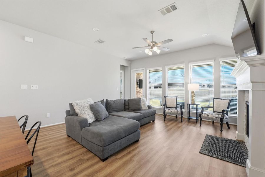 Family room with plenty of natural light and fireplace