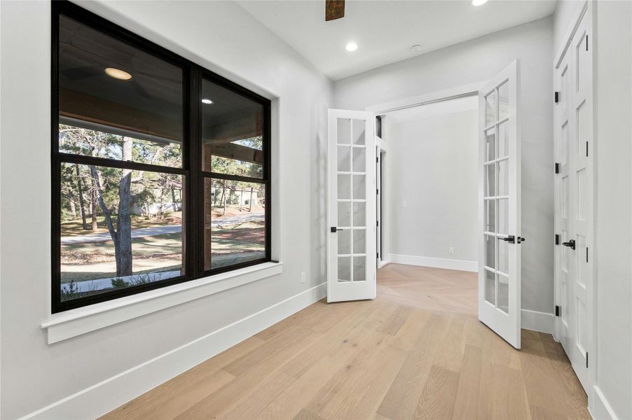 Interior space featuring light hardwood / wood-style floors and french doors