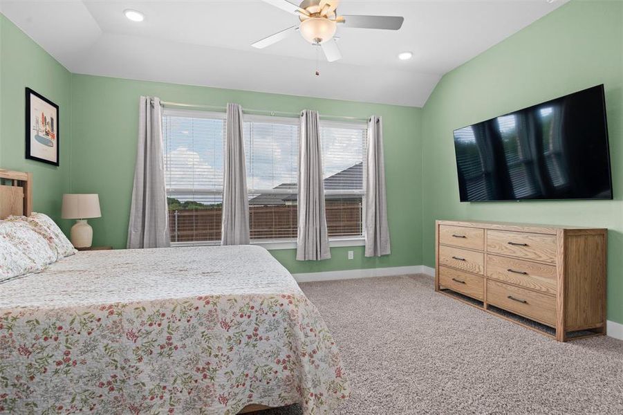 The primary bedroom offers lots of space to accommodate various combinations of furniture.
