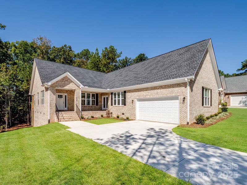 Front exterior of a new home in , Lancaster, SC, highlighting curb appeal (Image 1).