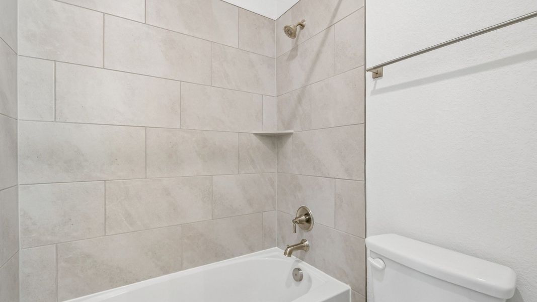 An interior shot of a shower in the Brown floorplan at Retreat at San Gabriel - Representative Image