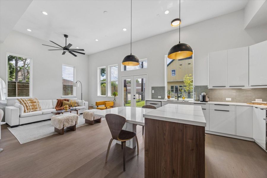 Designer kitchen anchored by a waterfall island, sleek cabinetry, and an open layout overlooking the main living area. Designer kitchen anchored by a waterfall island, sleek cabinetry, and an open layout overlooking the main living area.