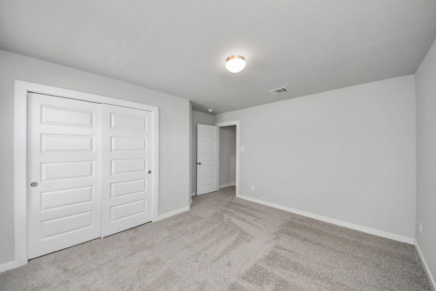 Generously sized secondary bedrooms featuring spacious closets, soft and inviting carpeting underfoot, large windows allowing plenty of natural light, and the added touch of privacy blinds for your personal retreat. Generously sized secondary bedrooms featuring spacious closets, soft and inviting carpeting underfoot, large windows allowing plenty of natural light, and the added touch of privacy blinds for your personal retreat.