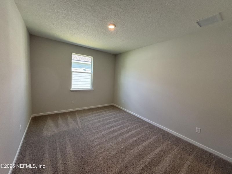 Spacious, unfurnished interior of a new home in The Magnolia Series at Reserve East, Flagler Beach (Image 13).