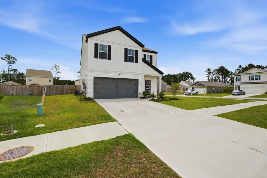 Front exterior of a new home in , Summerville, SC, highlighting curb appeal (Image 22). Front exterior of a new home in , Summerville, SC, highlighting curb appeal (Image 22).