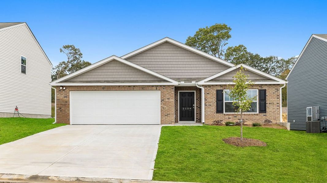 Front exterior of a new home in Harrier Point, Woodruff, SC, highlighting curb appeal (Image 1).