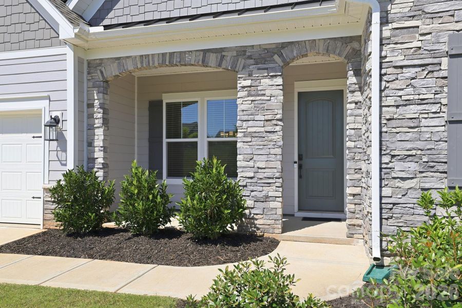 Exterior details and patio area of a home in Estates at Sugar Creek, Indian Land (Image 3).