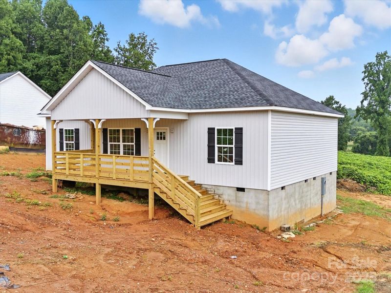 Front exterior of a new home in , Clover, SC, highlighting curb appeal (Image 18).