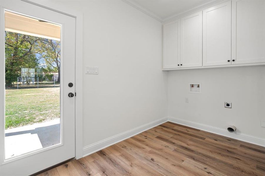 laundry room has glass door to backyard and covered porch with ceiling fan. laundry room has glass door to backyard and covered porch with ceiling fan.