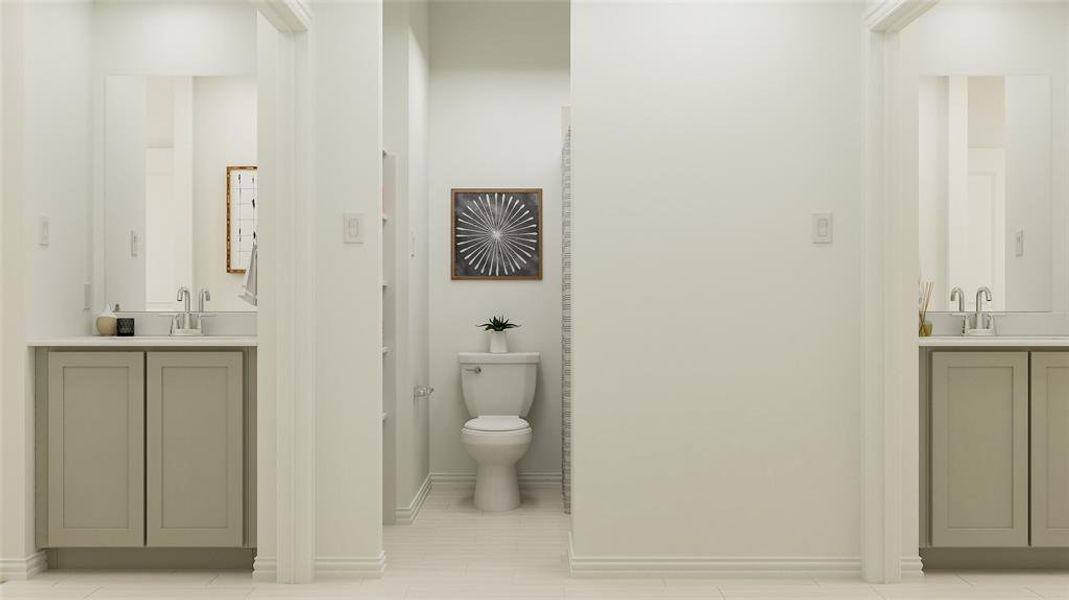 Bathroom with tile patterned floors, vanity, and toilet