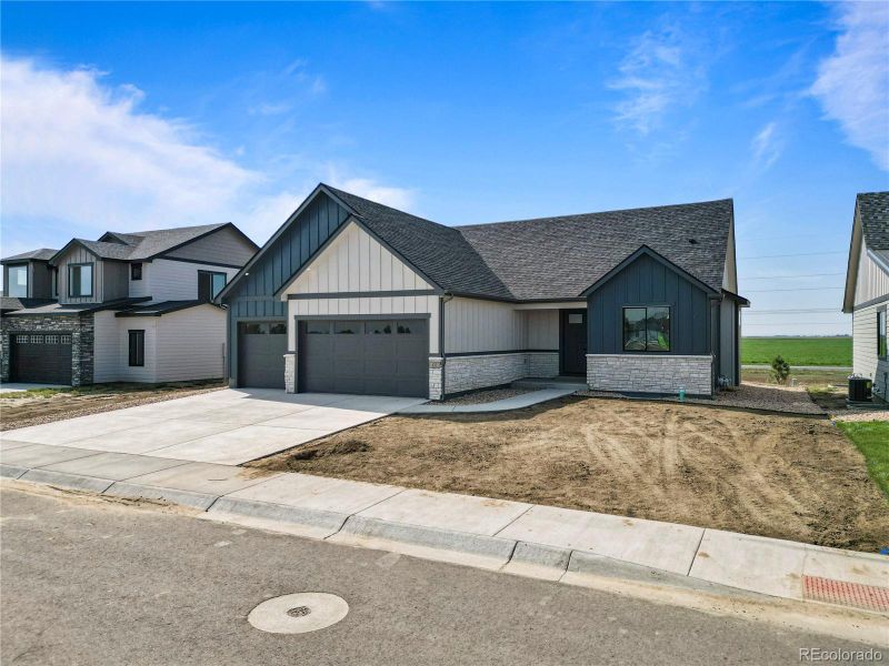 Front exterior of a new home in , Fort Morgan, CO, highlighting curb appeal (Image 24).