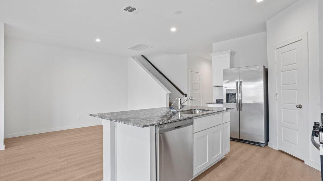 Furnished interior view inside a new home in Caldwell Crossing, Iowa Colony (Image 5).