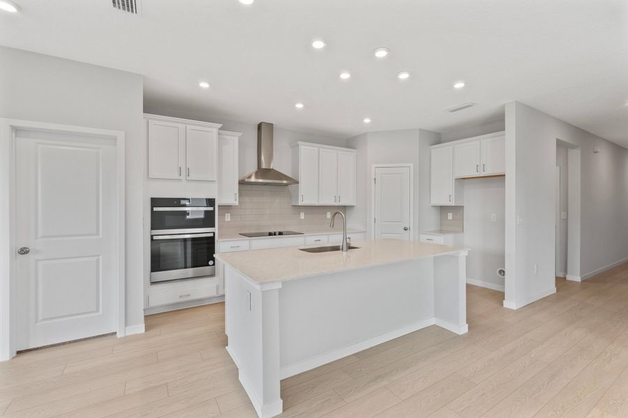 Palmetto Floorplan Lot 49 Chef's Kitchen with White Cabinets at Seminole Palms in Palm Coast Palmetto Floorplan Lot 49 Chef's Kitchen with White Cabinets at Seminole Palms in Palm Coast