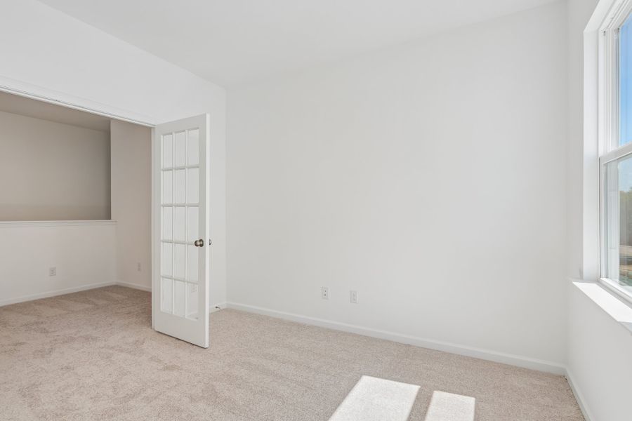 Spacious, unfurnished interior of a new home in Terraces at the Exchange, Indian Land (Image 21).