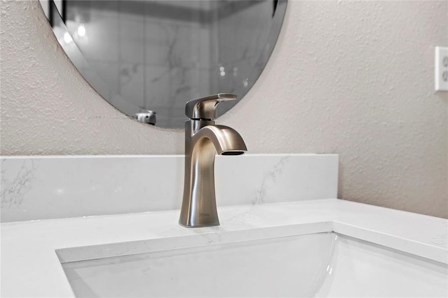 Bathroom view of a textured wall and vanity