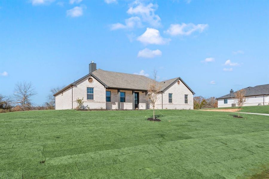 Front exterior of a new home in Saddleback Estates, Boyd, TX, highlighting curb appeal (Image 22).