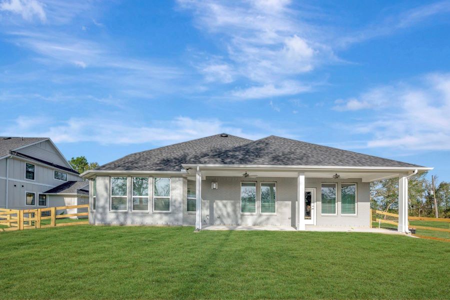 Exterior details and patio area of a home in The Oaks on 6th Street, Magnolia (Image 4).