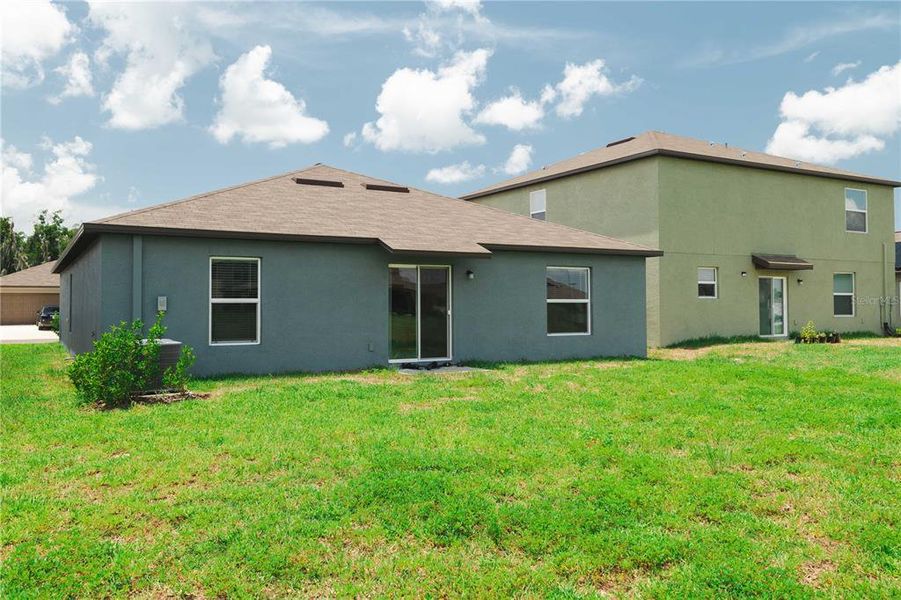 Front exterior of a new home in Triple Creek: The Estates II, Riverview, FL, highlighting curb appeal (Image 13). Front exterior of a new home in Triple Creek: The Estates II, Riverview, FL, highlighting curb appeal (Image 13).