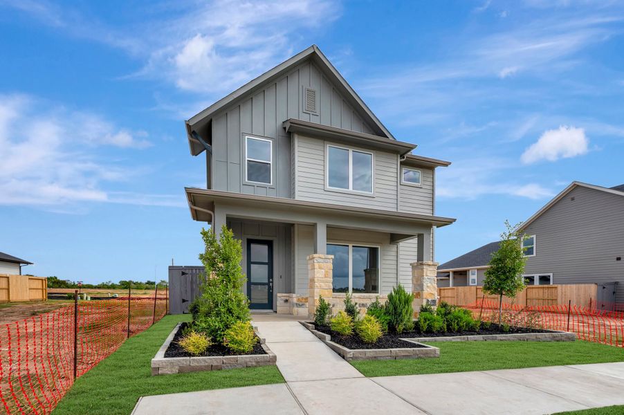 Front exterior of a new home in Jubilee - Grove Row Collection, Hockley, TX, highlighting curb appeal (Image 29). Front exterior of a new home in Jubilee - Grove Row Collection, Hockley, TX, highlighting curb appeal (Image 29).