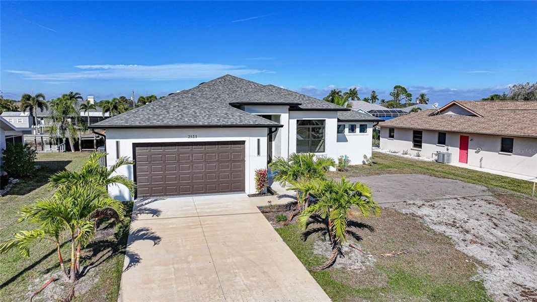 Front exterior of a new home in , Port Charlotte, FL, highlighting curb appeal (Image 18).