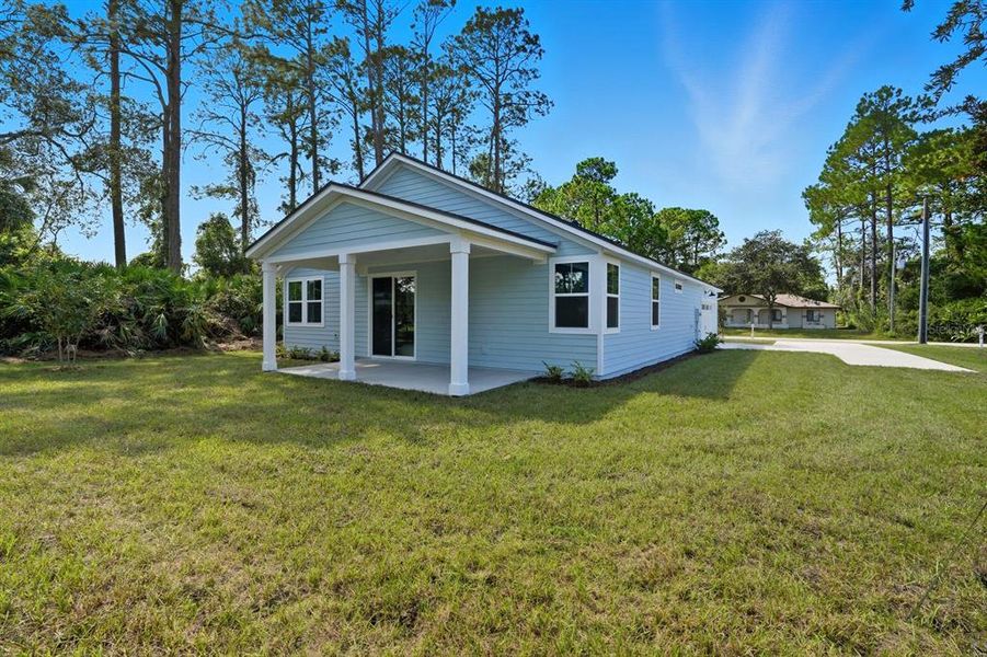 Exterior details and patio area of a home in Palm Coast Homes, Palm Coast (Image 4).