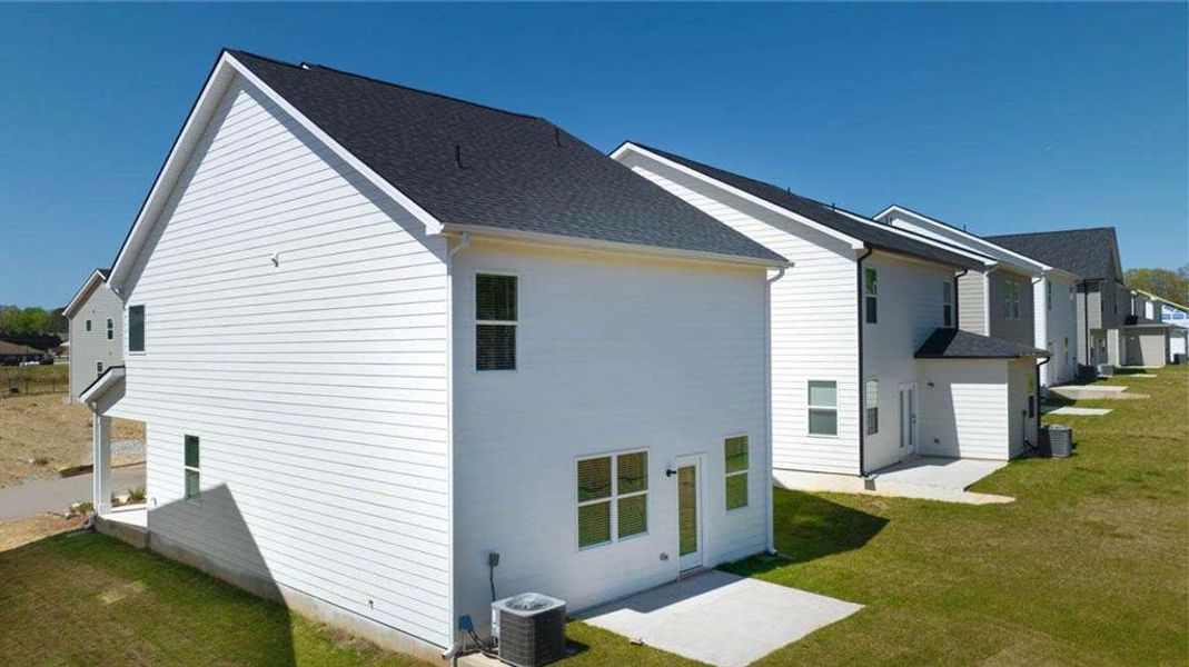 Front exterior of a new home in Shoal Creek, Hampton, GA, highlighting curb appeal (Image 1).