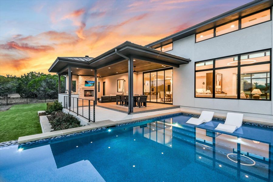 Back of house with an outdoor pool, a patio area, and an outdoor lounge area Back of house with an outdoor pool, a patio area, and an outdoor lounge area