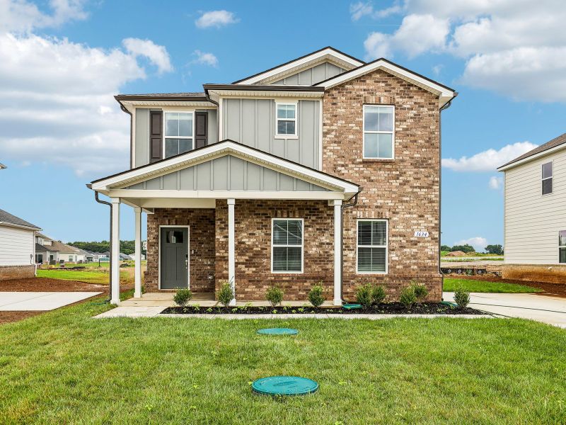 Front exterior of a new home in Avery Farms - Ridge Series, Murfreesboro, TN, highlighting curb appeal (Image 1). Front exterior of a new home in Avery Farms - Ridge Series, Murfreesboro, TN, highlighting curb appeal (Image 1).