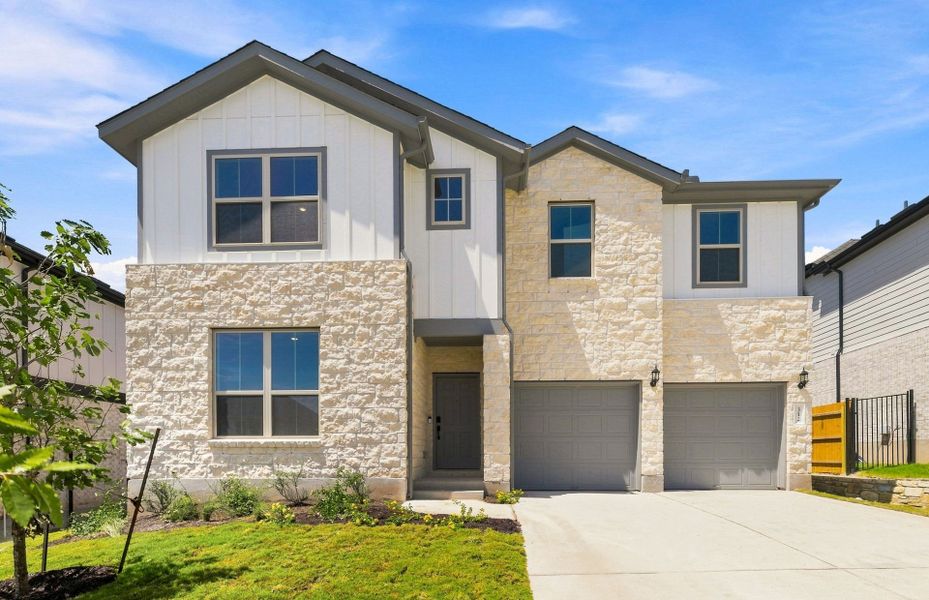 Front exterior of a new home in Saddleback at Santa Rita Ranch, Liberty Hill, TX, highlighting curb appeal (Image 21).