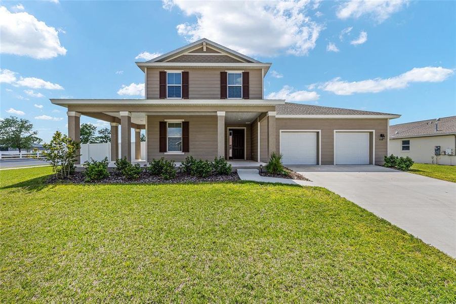 Front exterior of a new home in Calesa Township, Ocala, FL, highlighting curb appeal (Image 25). Front exterior of a new home in Calesa Township, Ocala, FL, highlighting curb appeal (Image 25).