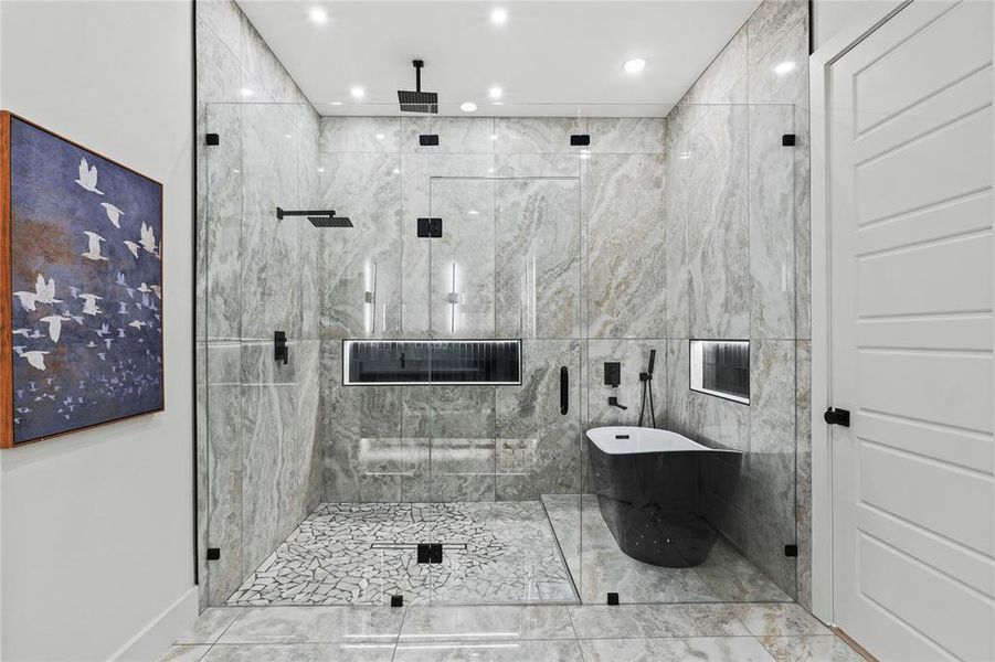 Bathroom featuring separate shower and tub