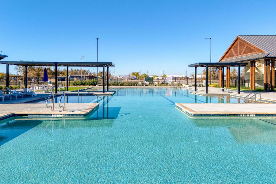 The sparkling community pool features a shallow entry area, making it incredibly easy to wade in and enjoy a relaxing afternoon The sparkling community pool features a shallow entry area, making it incredibly easy to wade in and enjoy a relaxing afternoon