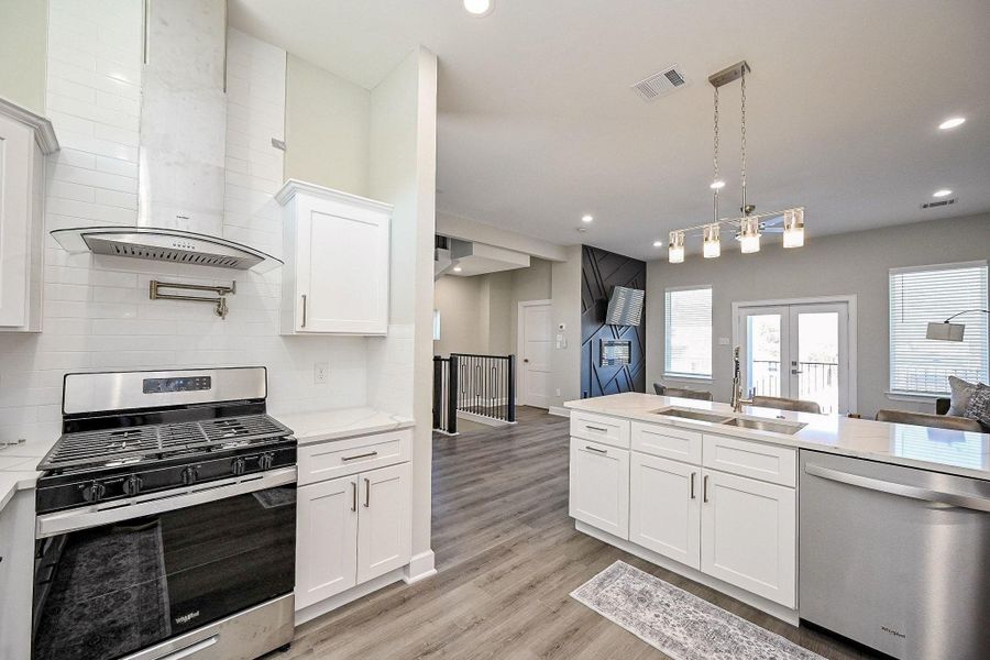 Bright contemporary kitchen with clean finishes and ample prep space for everyday living.